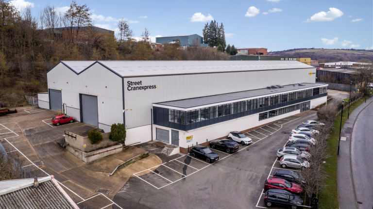 The Street Cranexpress head office with cars parked in front of it