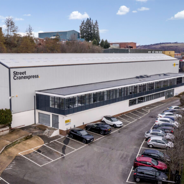 The Street Cranexpress head office with cars parked in front of it