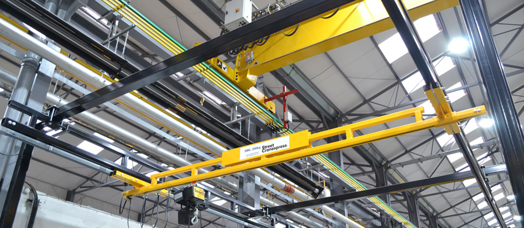 A yellow light crane in a warehouse